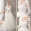 Illusion Ivory / Creme Durchsichtige Brautkleider / Hochzeitskleider 2018 A Linie Rundhalsausschnitt Lange Ärmel Rückenfreies Applikationen Spitze Sweep / Pinsel Zug Rüschen