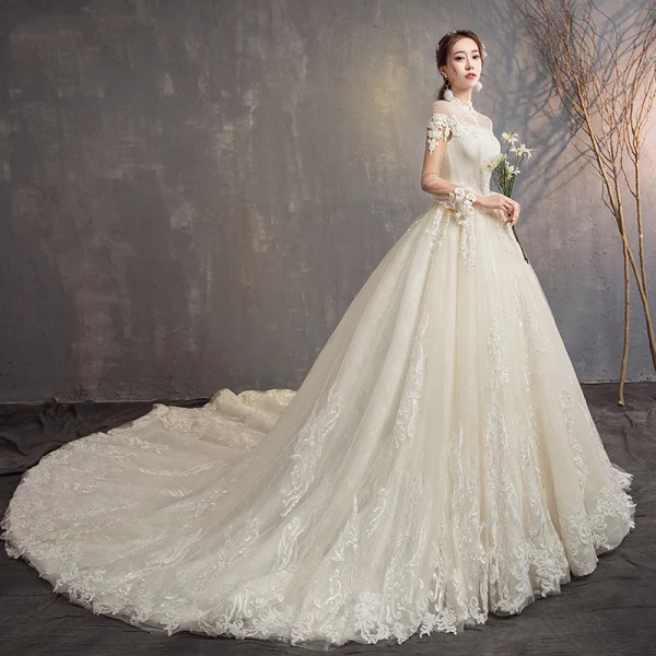 Modern / Fashion Champagne See-through Wedding Dresses 2019 A-Line / Princess High Neck Long Sleeve Backless Appliques Lace Beading Glitter Tulle Cathedral Train Ruffle