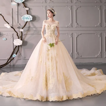 Luxury Gorgeous Champagne See Through Wedding Dresses 2019 Ball Gown Scoop Neck Short Sleeve Backless Gold Appliques Lace Beading Glitter Tulle Cathedral Train Ruffle