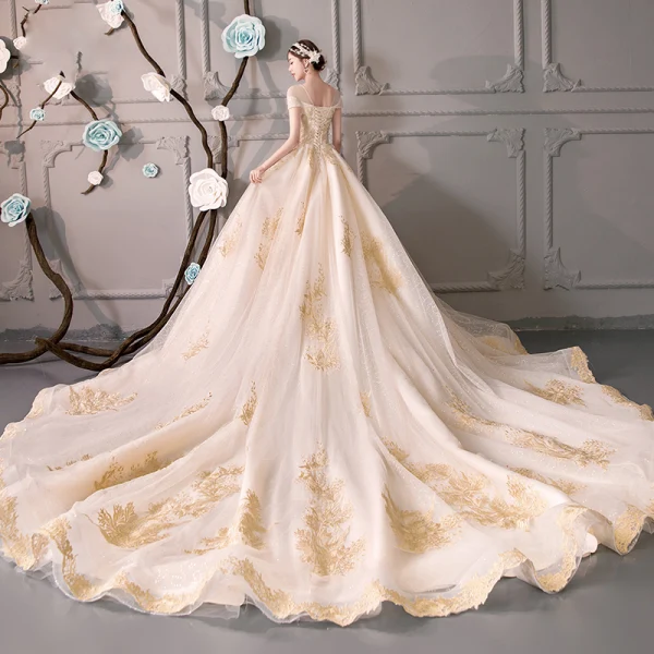 Luxury / Gorgeous Champagne See-through Wedding Dresses 2019 Ball Gown Scoop Neck Short Sleeve Backless Gold Appliques Lace Beading Glitter Tulle Cathedral Train Ruffle