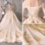 Luxury / Gorgeous Champagne See-through Wedding Dresses 2019 Ball Gown Scoop Neck Short Sleeve Backless Gold Appliques Lace Beading Glitter Tulle Cathedral Train Ruffle