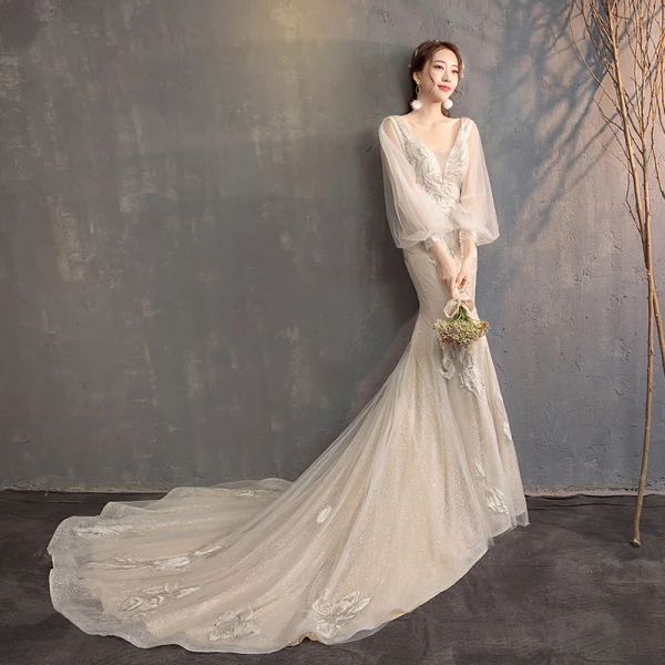 Bling Bling Champagne Wedding Dresses 2019 Trumpet / Mermaid V-Neck Puffy Long Sleeve Backless Appliques Lace Glitter Tulle Chapel Train Ruffle