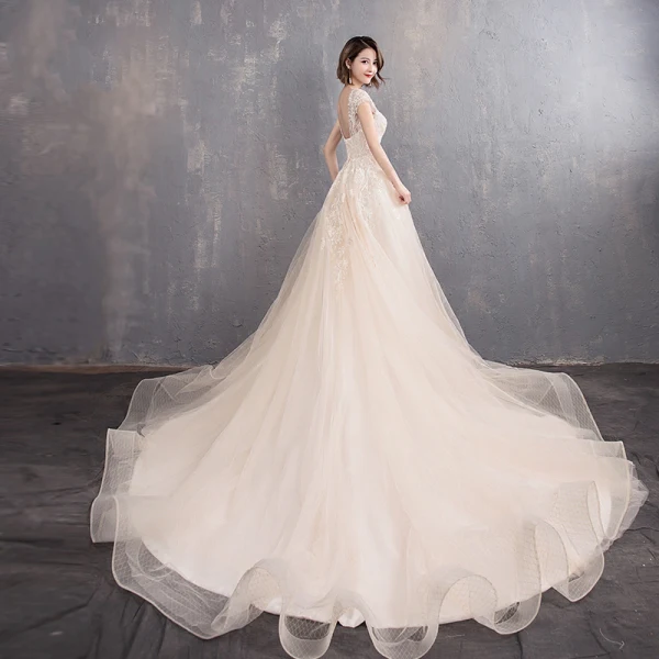 Élégant Champagne Transparentes Robe De Mariée 2019 Princesse Encolure Dégagée Mancherons Dos Nu Appliques En Dentelle Perlage Perle Chapel Train Volants
