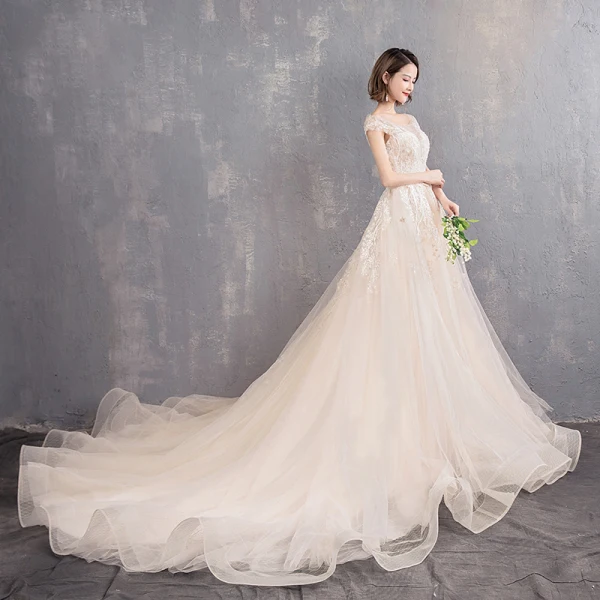Élégant Champagne Transparentes Robe De Mariée 2019 Princesse Encolure Dégagée Mancherons Dos Nu Appliques En Dentelle Perlage Perle Chapel Train Volants