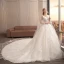 Charmant Ivoire Transparentes Robe De Mariée 2019 Robe Boule V-Cou Sans Manches Dos Nu Appliques En Dentelle Fleur Perle Perlage Watteau Train Volants