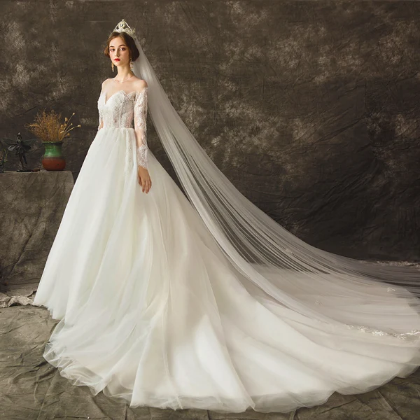 Charming Ivory See-through Wedding Dresses 2019 Ball Gown Scoop Neck Long Sleeve Backless Appliques Lace Beading Pearl Chapel Train Ruffle