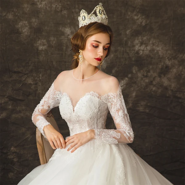 Charming Ivory See-through Wedding Dresses 2019 Ball Gown Scoop Neck Long Sleeve Backless Appliques Lace Beading Pearl Chapel Train Ruffle