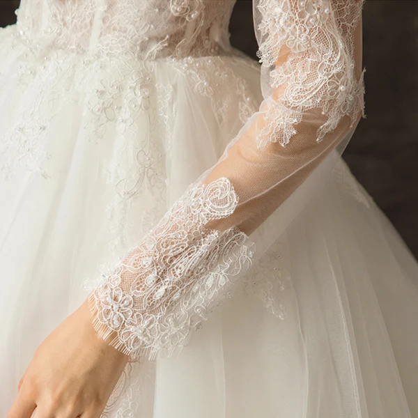 Charming Ivory See-through Wedding Dresses 2019 Ball Gown Scoop Neck Long Sleeve Backless Appliques Lace Beading Pearl Chapel Train Ruffle