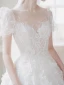 Illusion Champagne La Mariée Robe De Mariée 2021 Princesse Transparentes Encolure Dégagée Gonflée Manches Courtes Dos Nu Appliques En Dentelle Perlage Tribunal Train Volants