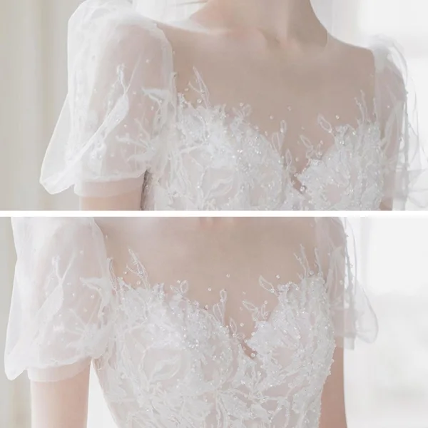 Illusion Champagne La Mariée Robe De Mariée 2021 Princesse Transparentes Encolure Dégagée Gonflée Manches Courtes Dos Nu Appliques En Dentelle Perlage Tribunal Train Volants