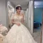 Illusion Champagne La Mariée Robe De Mariée 2021 Princesse Transparentes Encolure Dégagée Gonflée Manches Courtes Dos Nu Appliques En Dentelle Perlage Tribunal Train Volants