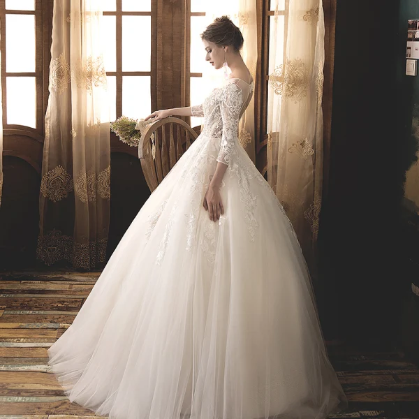 Illusion Champagne Transparentes Robe De Mariée 2019 Princesse Encolure Dégagée 3/4 Manches Dos Nu Appliques En Dentelle Perle Longue Volants