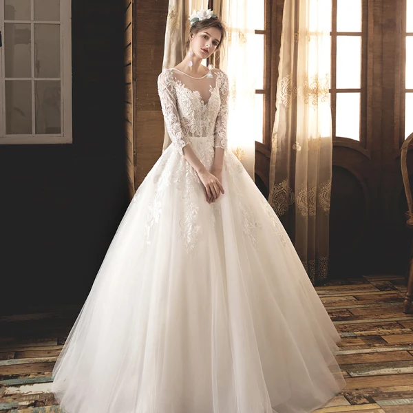 Illusion Champagne Transparentes Robe De Mariée 2019 Princesse Encolure Dégagée 3/4 Manches Dos Nu Appliques En Dentelle Perle Longue Volants