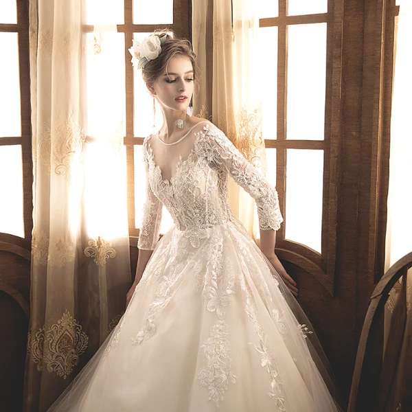 Illusion Champagne Transparentes Robe De Mariée 2019 Princesse Encolure Dégagée 3/4 Manches Dos Nu Appliques En Dentelle Perle Longue Volants