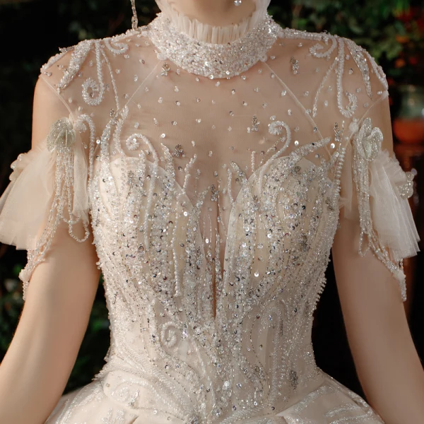 Luxe Champagne Transparentes La Mariée Robe De Mariée 2021 Robe Boule Col Haut Manches Courtes Dos Nu Fait main Perlage Paillettes Glitter Tulle Royal Train Volants
