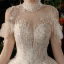 Luxe Champagne Transparentes La Mariée Robe De Mariée 2021 Robe Boule Col Haut Manches Courtes Dos Nu Fait main Perlage Paillettes Glitter Tulle Royal Train Volants