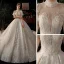 Luxe Champagne Transparentes La Mariée Robe De Mariée 2021 Robe Boule Col Haut Manches Courtes Dos Nu Fait main Perlage Paillettes Glitter Tulle Royal Train Volants
