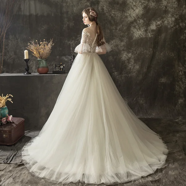 Illusion Champagne Transparentes Robe De Mariée 2019 Princesse Encolure Dégagée Manches de cloche Appliques En Dentelle Perle Glitter Tulle Tribunal Train Volants
