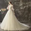Illusion Champagne Transparentes Robe De Mariée 2019 Princesse Encolure Dégagée Manches de cloche Appliques En Dentelle Perle Glitter Tulle Tribunal Train Volants