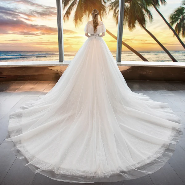 Modern / Fashion Ivory See-through Wedding Dresses 2019 A-Line / Princess Scoop Neck Short Sleeve Backless Beading Glitter Tulle Chapel Train Ruffle
