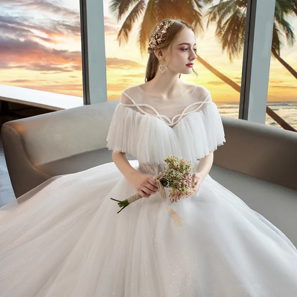 Modern / Fashion Ivory See-through Wedding Dresses 2019 A-Line / Princess Scoop Neck Short Sleeve Backless Beading Glitter Tulle Chapel Train Ruffle