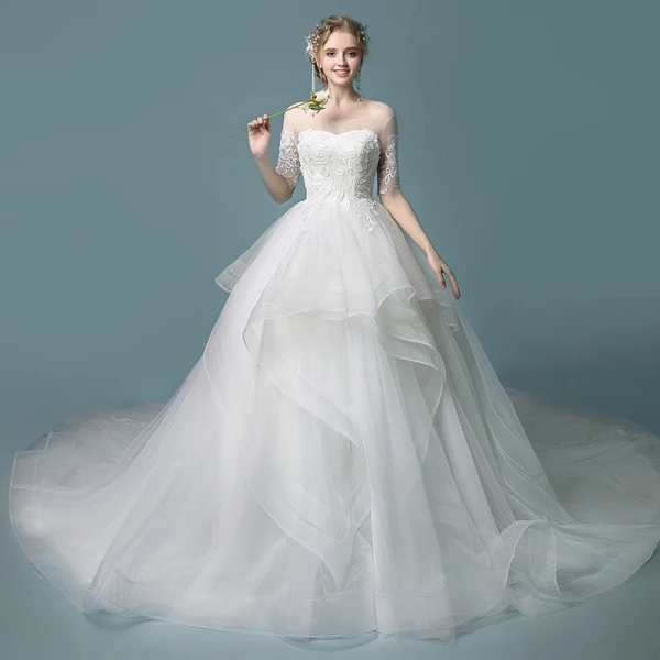 Affordable Ivory See-through Wedding Dresses 2019 Ball Gown Scoop Neck 1/2 Sleeves Backless Appliques Lace Chapel Train Cascading Ruffles