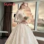 Illusion Champagne Pierced Wedding Dresses 2019 A-Line / Princess High Neck Long Sleeve Backless Appliques Lace Cathedral Train Ruffle