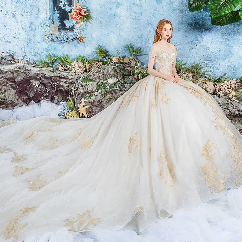 Luxury Gorgeous Champagne Wedding Dresses 2019 Ball Gown Off The Shoulder  Short Sleeve Backless Appliques Lace Beading Cathedral Train Ruffle