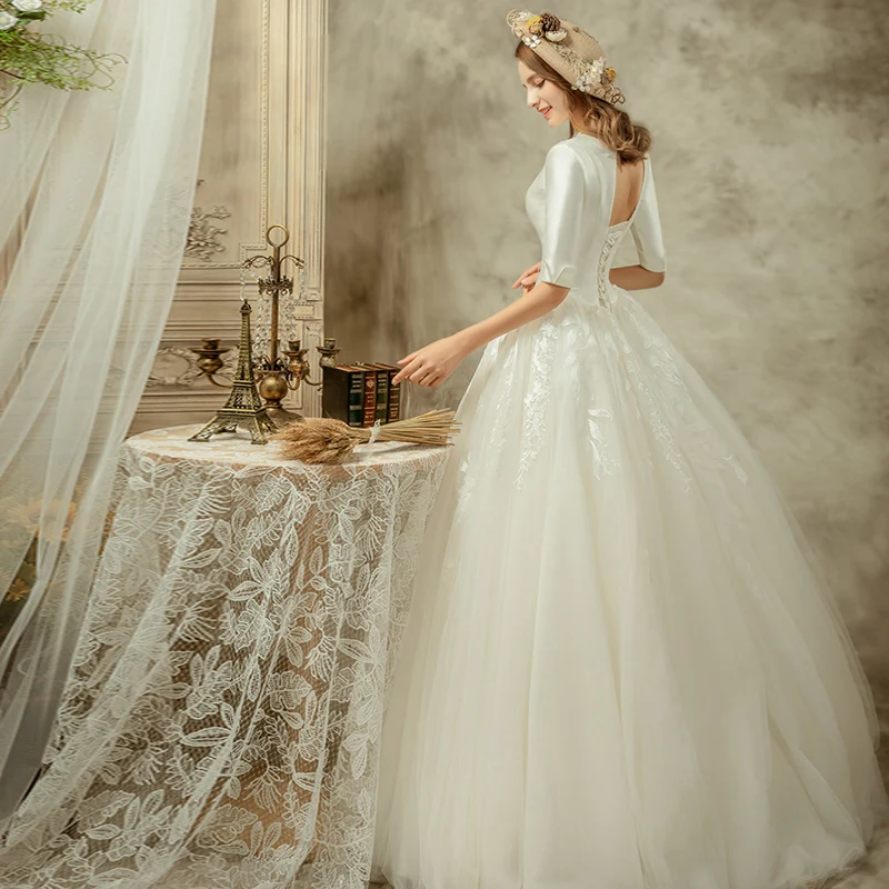 Audrey Hepburn Style Ivory Wedding Dresses 2019 A Line Princess V Neck 1 2  Sleeves Backless Floor Length Long Ruffle
