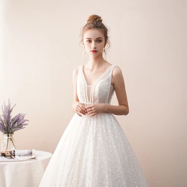 Meilleur Ivoire Transparentes Dentelle Robe De Mariée 2019 Princesse V-Cou Sans Manches Dos Nu Perlage Longue Volants