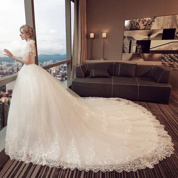 Vintage Ivory Pierced Wedding Dresses 2018 Ball Gown High Neck Short Sleeve Backless Appliques Lace Pearl Beading Tassel Royal Train
