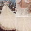 Vintage Ivory Pierced Wedding Dresses 2018 Ball Gown High Neck Short Sleeve Backless Appliques Lace Pearl Beading Tassel Royal Train