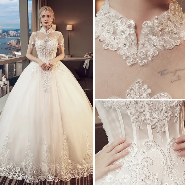 Vintage Ivory Pierced Wedding Dresses 2018 Ball Gown High Neck Short Sleeve Backless Appliques Lace Pearl Beading Tassel Royal Train