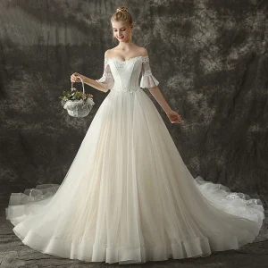 Élégant Champagne Robe De Mariée 2019 Princesse De L 039 Épaule 1 2 Manches Dos Nu Appliques En Dentelle Glitter Tulle Chapel Train Volants