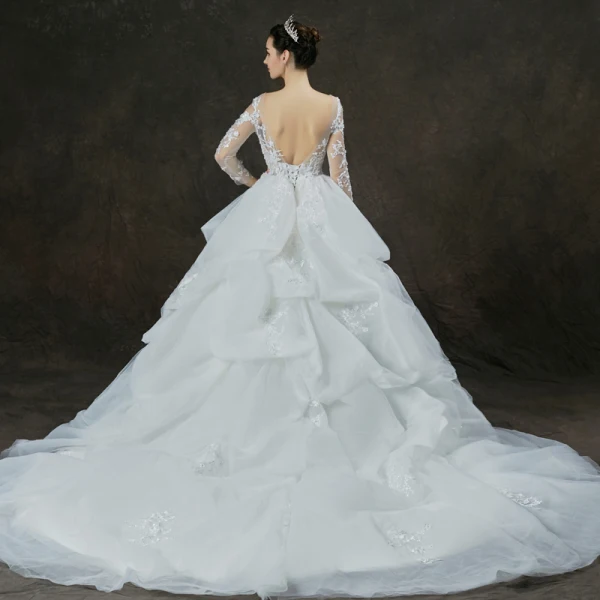 Illusion Weiß Durchsichtige Brautkleider / Hochzeitskleider 2019 Ballkleid Rundhalsausschnitt Lange Ärmel Rückenfreies Applikationen Spitze Perle Perlenstickerei Kathedrale Schleppe Fallende Rüsche