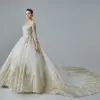 Luxury / Gorgeous Champagne See-through Wedding Dresses 2019 A-Line / Princess Scoop Neck Long Sleeve Backless Appliques Lace Beading Glitter Tulle Cathedral Train Ruffle