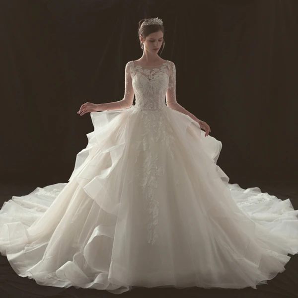 Illusion Champagne Pierced Wedding Dresses 2019 Ball Gown Scoop Neck 3/4 Sleeve Backless Appliques Lace Beading Cathedral Train Cascading Ruffles