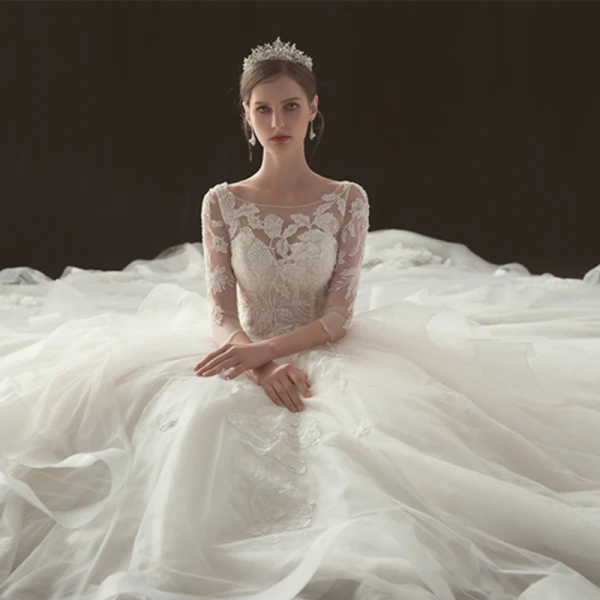 Illusion Champagne Pierced Wedding Dresses 2019 Ball Gown Scoop Neck 3/4 Sleeve Backless Appliques Lace Beading Cathedral Train Cascading Ruffles