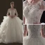 Illusion Champagne Pierced Wedding Dresses 2019 Ball Gown Scoop Neck 3/4 Sleeve Backless Appliques Lace Beading Cathedral Train Cascading Ruffles