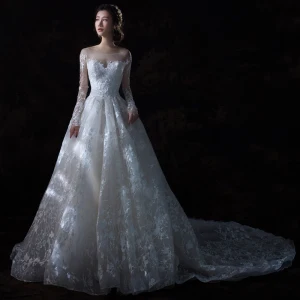 Étourdissant Champagne Percé Robe De Mariée 2018 Robe Boule Encolure Dégagée Manches Longues Dos Nu Appliques En Dentelle Royal Train Volants