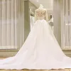 Stunning White Pierced Wedding Dresses 2018 Ball Gown Scoop Neck Long Sleeve Backless Appliques Lace Ruffle Royal Train