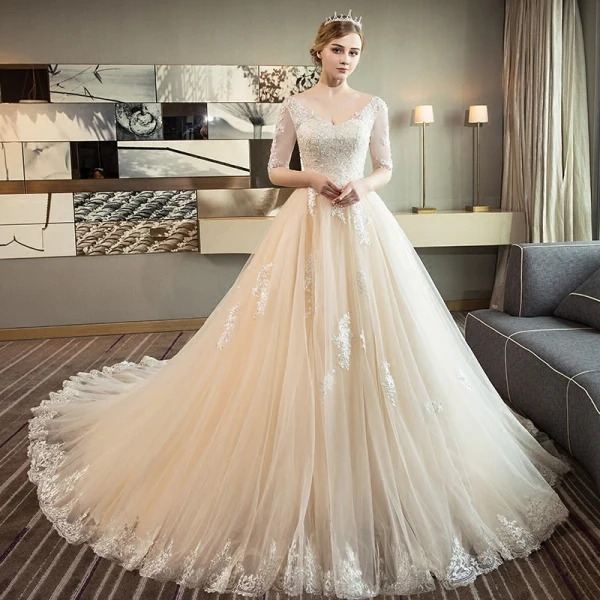 Elegant Champagne Wedding Dresses 2018 Ball Gown V-Neck 1/2 Sleeves Backless Appliques Lace Sequins Pearl Ruffle Cathedral Train