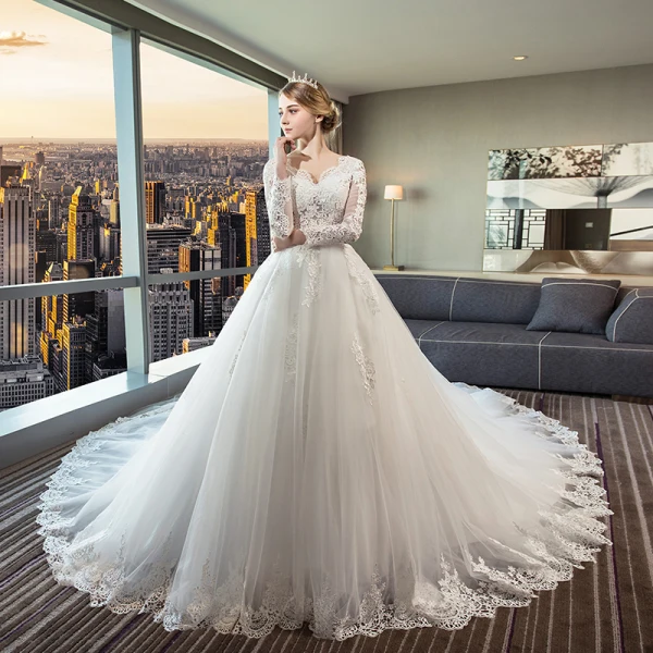 Schöne Ivory / Creme Durchsichtige Brautkleider 2018 Ballkleid V-Ausschnitt Lange Ärmel Rückenfreies Applikationen Mit Spitze Rüschen Königliche Schleppe