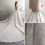 Luxus / Herrlich Ivory / Creme Durchsichtige Brautkleider / Hochzeitskleider 2019 A Linie Rundhalsausschnitt Lange Ärmel Rückenfreies Handgefertigt Perlenstickerei Perle Pailletten Kathedrale Schleppe Rüschen