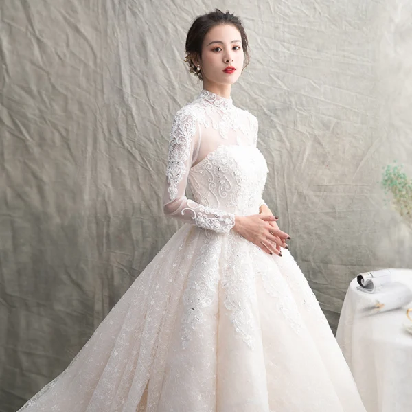 Luxury / Gorgeous Champagne See-through Wedding Dresses 2019 A-Line / Princess High Neck Long Sleeve Backless Appliques Lace Beading Glitter Tulle Cathedral Train Ruffle