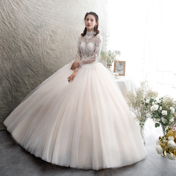 Illusion Champagner Durchsichtige Brautkleider / Hochzeitskleider 2019 A Linie Stehkragen Lange Ärmel Rückenfreies Applikationen Spitze Perlenstickerei Lange Rüschen