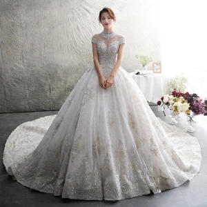 Luxe Ivoire Transparentes Robe De Mariée 2019 Robe Boule Col Haut Manches Courtes Dos Nu Appliques En Dentelle Faux Diamant Perlage Glitter Tulle Cathedral Train Volants