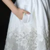 Modern / Fashion Ivory Wedding Dresses 2018 A-Line / Princess V-Neck Sleeveless Backless Ruffle Court Train
