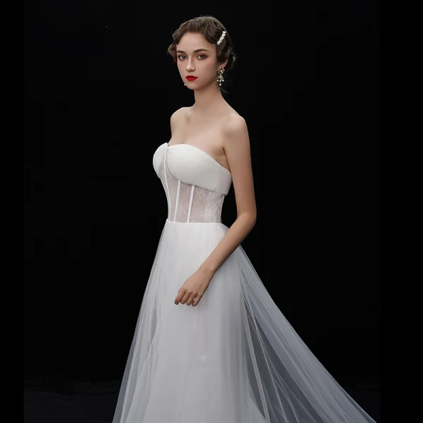 Glamour Ivoire Transparentes Robe De Mariée 2019 Trompette / Sirène Bustier Sans Manches Dos Nu Chapel Train Volants