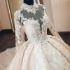 Luxury / Gorgeous Vintage / Retro Champagne See-through Wedding Dresses 2019 Audrey Hepburn Style Ball Gown High Neck Long Sleeve Backless Appliques Lace Beading Glitter Tulle Cathedral Train Ruffle